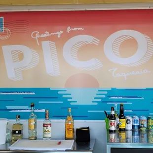 a variety of drinks on a counter