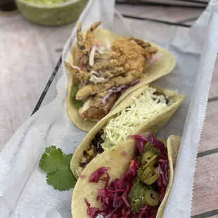 Chicken, soft shell and carnita (pork).