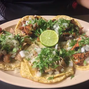 Tacos de carnitas (the best), al pastor, and chorizo