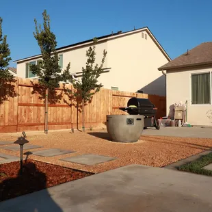 a backyard with a fire pit