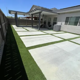 Concrete pavers (custom sizing) and synthetic installation (Bermuda blend pro)