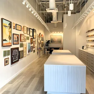 Design inspiration gallery wall of framed keepsakes, canvas prints and local Hawaii artwork.