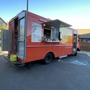 a food truck parked in a parking lot