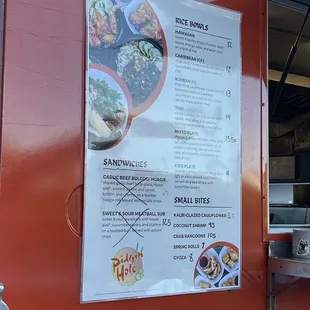 a menu on the side of a food truck