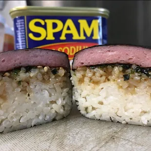 two pieces of sushi with a can of spam in the background