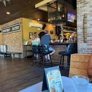 people sitting at the bar