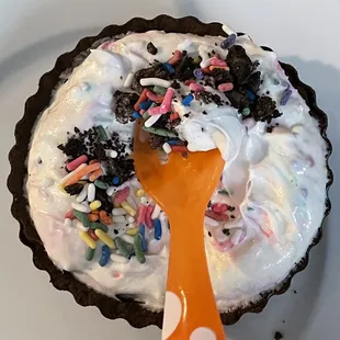 Son created this chocolate crust, birthday cake with Oreos and sprinkles