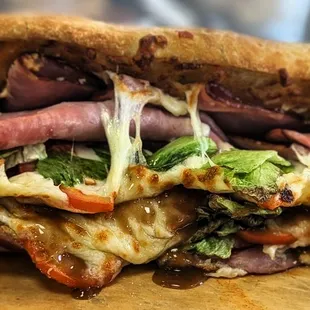 a cut in half sandwich on a cutting board