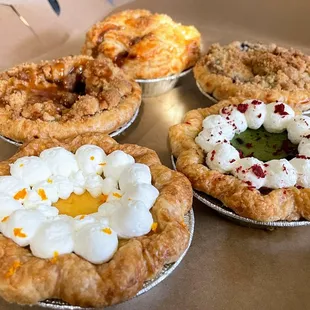a variety of pies in a box