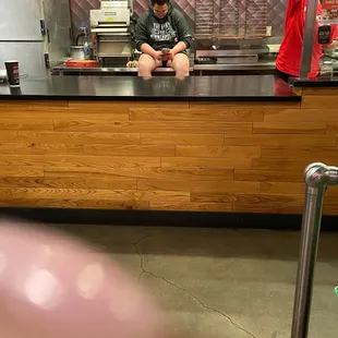 Employee still in counter! She did not care that there were patrons in the restaurant.