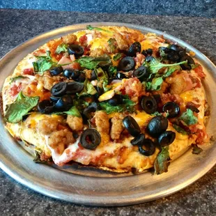 Pie Five High Five loaded with black olives, extra sausage, and spinach!