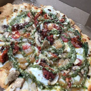 Pesto Chicken Alfredo with added garlic, spinach, ricotta, sun dried tomatoes, mushrooms, &amp; magic dust.