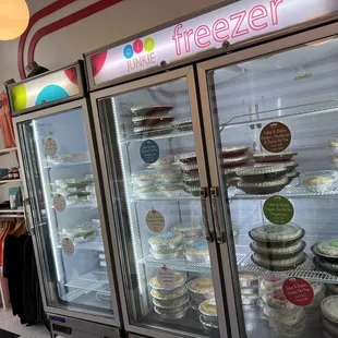a display of pies in a freezer