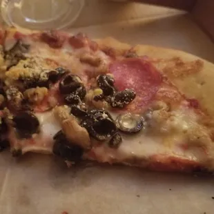 Pepperoni, sausage, black olives and mushroom over a spicy marinara.