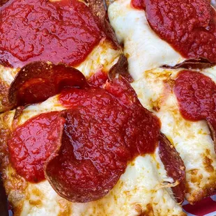 a pepperoni pizza in a box