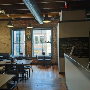 a restaurant with tables and chairs