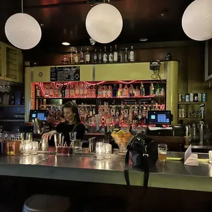 a woman sitting at a bar
