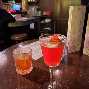 two cocktails on a table