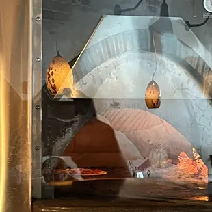My pizza coooking in wood fired oven!