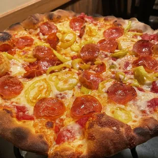 Create your own 12&quot; pizza with rich tomato sauce, pepperoni, and banana peppers