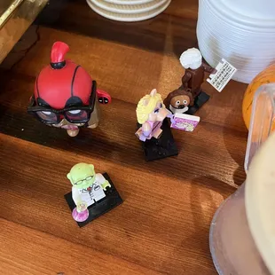 a couple of figurines on a table