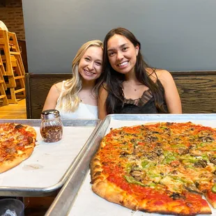 For size reference, the pizza on the left is a medium pizza and the right is a large pizza. These pizzas are HUGE, definitely worth it!