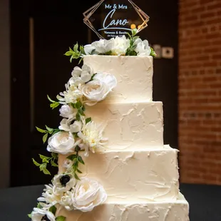 Stunning 4 tier cake, with stucco design and florals.