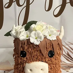 a cow with flowers on its head
