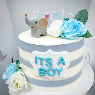 a blue and white striped cake