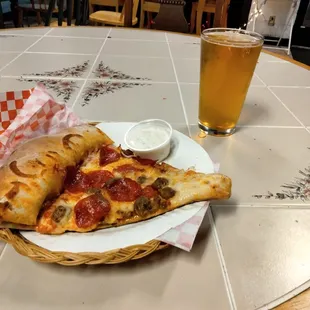Pep and sausage pizza with IPA