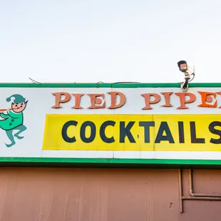 a sign for a cocktail bar