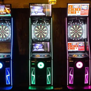 a row of three arcade machines