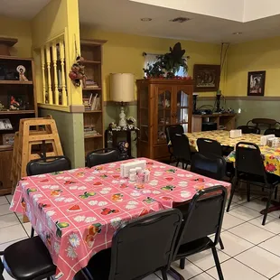 a dining room with tables and chairs