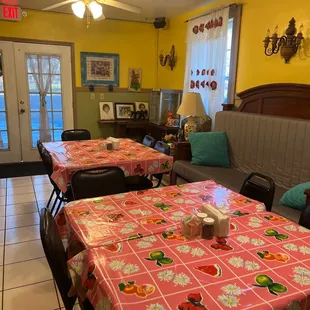a dining area with tables and chairs