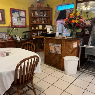 a kitchen with a table and chairs