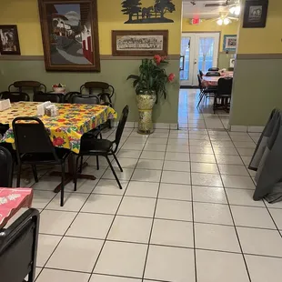 a dining room with tables and chairs