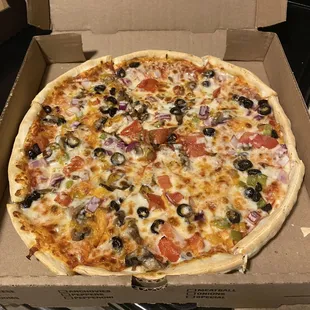 Fresh medium supreme pizza with thin crust.