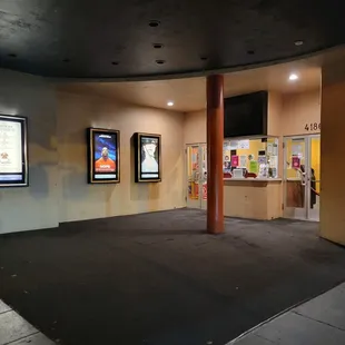 Night shot looking from sidewalk to entrance