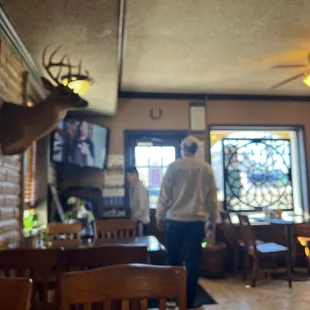 a man standing in a restaurant