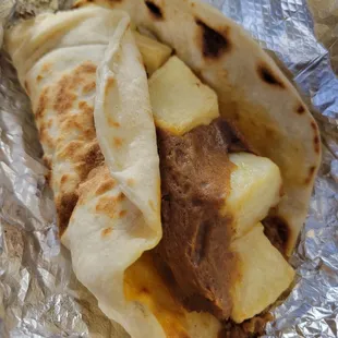 Chorizo, bean, and potato taco in flour tortilla