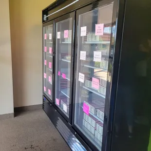 a refrigerator with sticky notes on it