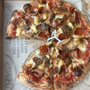 Pepperoni and pineapple with truffle mushroom pizza