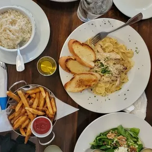 Cajun shrimp, pasta, secret salad, fries and rice