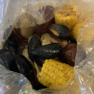 Pier 11's Build Your Own with 1/2 lb. Snow Crab Legs, 1/2 lb. Shrimp (No Shell), and 1/2 lb. Black Mussels.