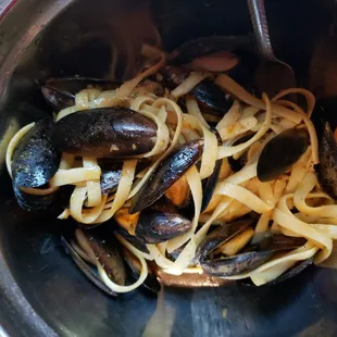 Black mussels with garlic butter and noodles.