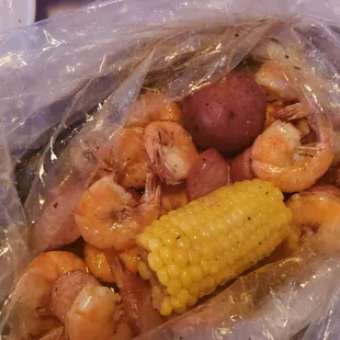 Shrimp, sausage, corn, and potatoes.