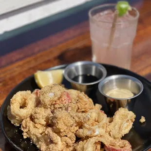 This calamari with the savory dipping sauces were mouth watering delicious!.