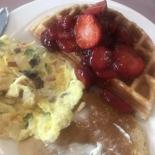 Western Omelette with bacon instead of ham, Belgium waffles with fruit and a side of pancakes.