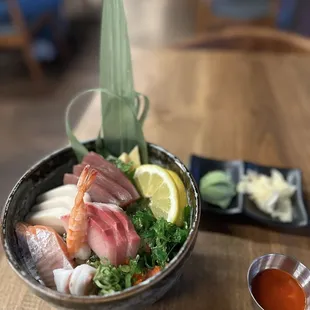 Chirashi don w sriracha sauce on the side. The rice was seasoned w furikaki. Nice touch!
