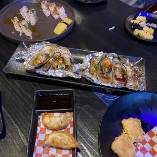 Gyoza, baked green mussels, &amp; nigiri